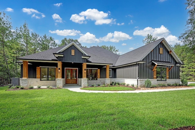 view of front facade featuring french doors and a front lawn