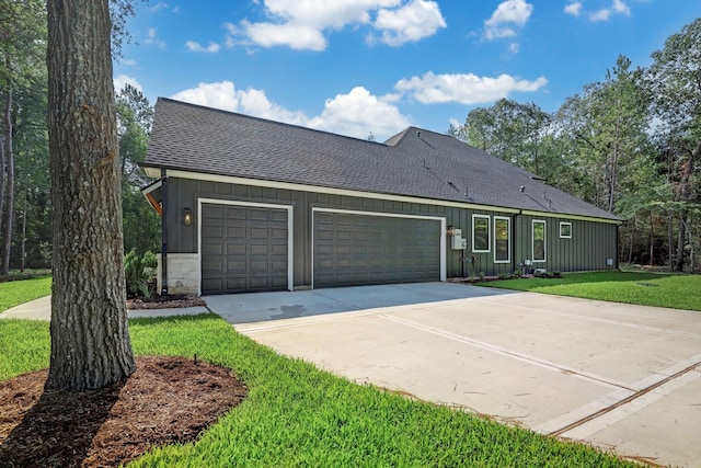 ranch-style house with a front yard and a garage