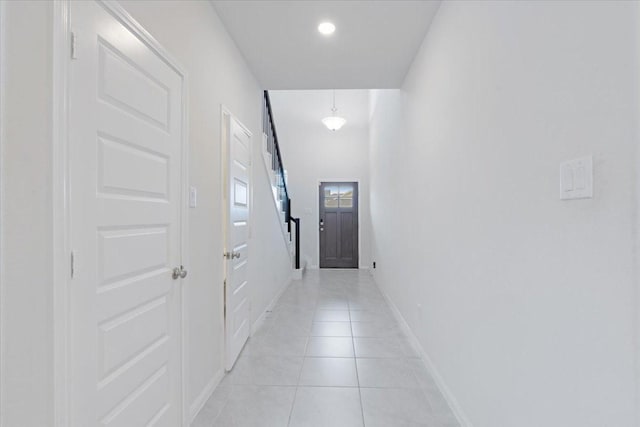 hall with light tile patterned flooring