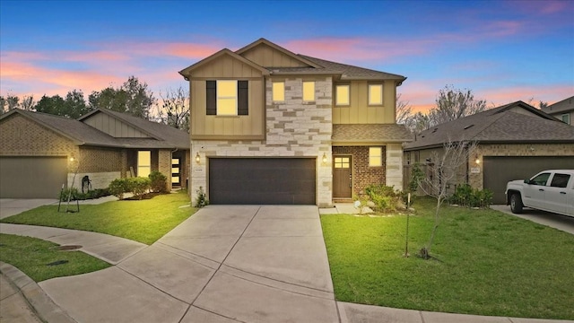 craftsman-style house with a yard and a garage