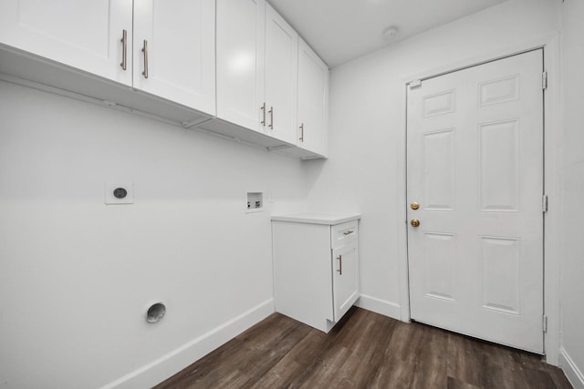 washroom featuring electric dryer hookup, hookup for a washing machine, dark hardwood / wood-style flooring, and cabinets