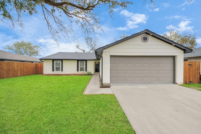 ranch-style home featuring a front lawn and a garage