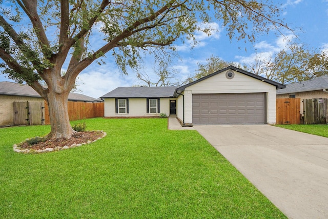 ranch-style house with a garage and a front lawn