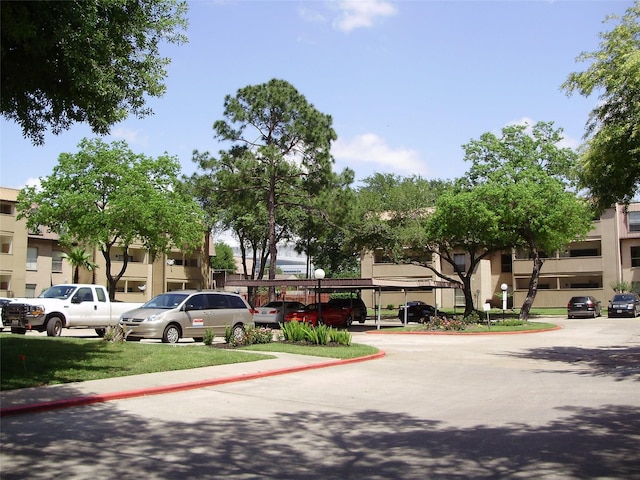 view of parking / parking lot with a carport