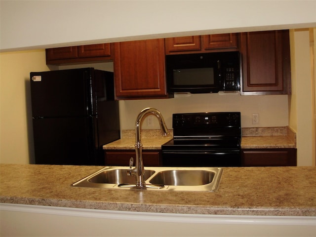 kitchen with sink and black appliances