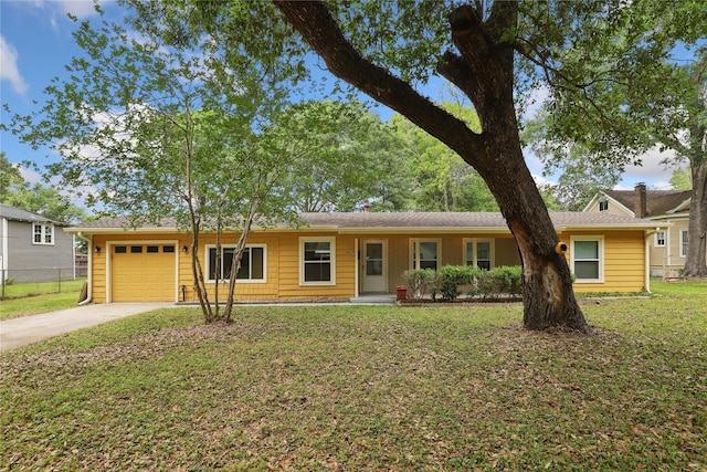 single story home featuring a front yard and a garage