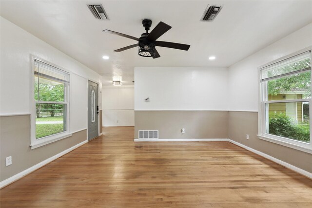 empty room featuring ceiling fan and light wood-type flooring