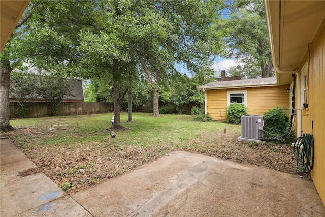 view of yard featuring central AC and a patio area