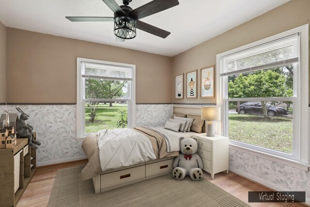 bedroom featuring ceiling fan and light hardwood / wood-style flooring