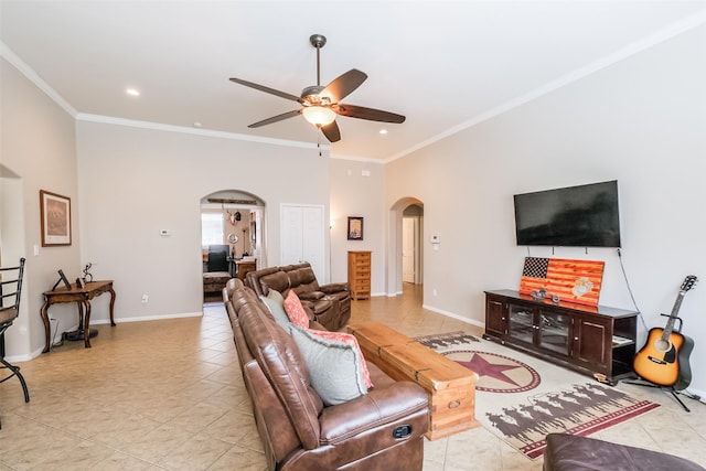 living room with ceiling fan, light tile patterned flooring, and crown molding