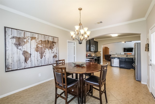 dining room featuring ceiling fan with notable chandelier, light tile patterned floors, and crown molding