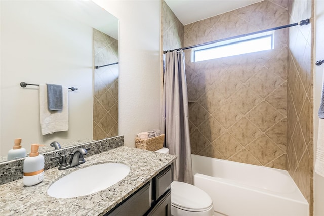 full bathroom with vanity, shower / bath combo, and toilet