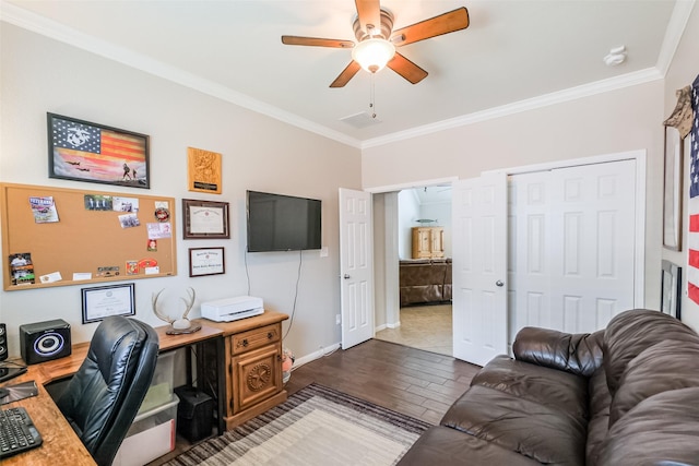 office area featuring dark hardwood / wood-style flooring, ceiling fan, and ornamental molding