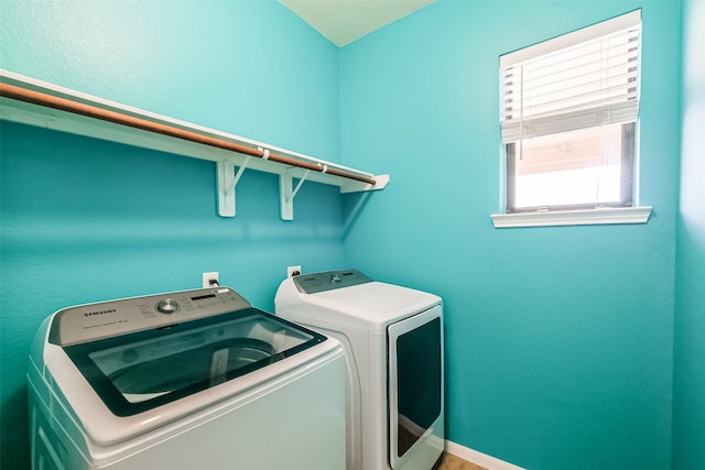 laundry room featuring separate washer and dryer