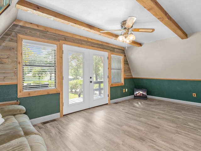 entryway featuring french doors, light wood-type flooring, lofted ceiling with beams, and ceiling fan