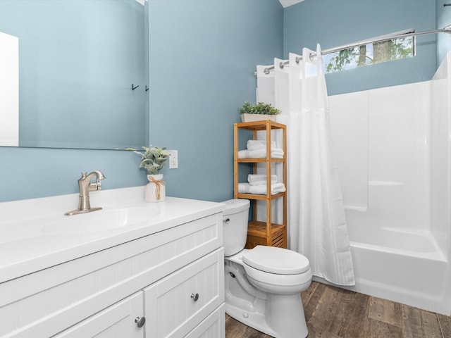 full bathroom featuring shower / bath combination with curtain, vanity, toilet, and hardwood / wood-style floors