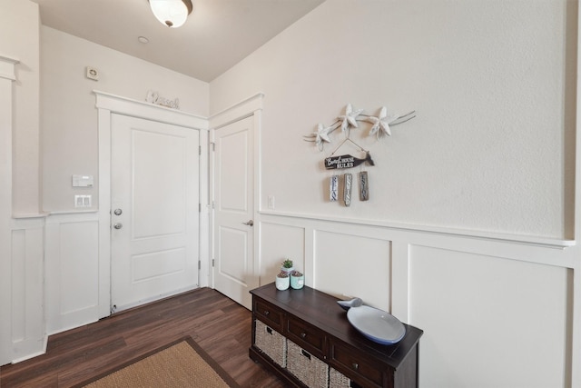 entryway with dark hardwood / wood-style flooring