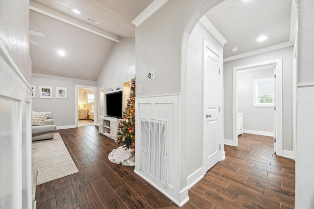 hallway with lofted ceiling with beams and ornamental molding