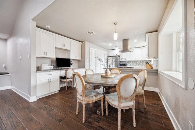 dining room featuring dark hardwood / wood-style flooring