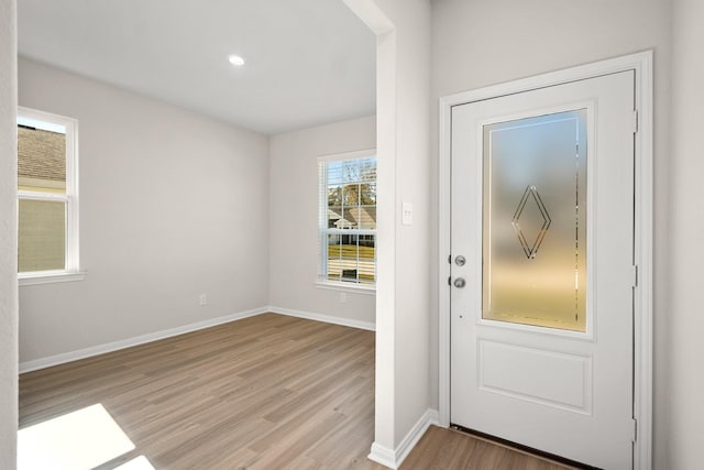 doorway to outside with light wood-type flooring