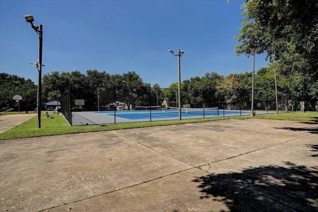 view of sport court featuring tennis court