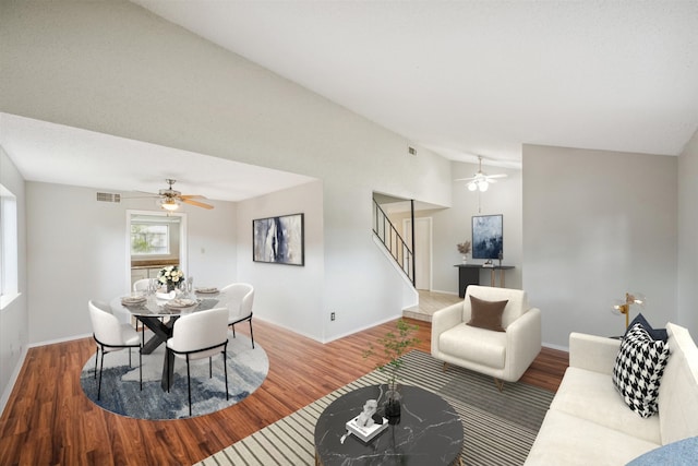 living room with hardwood / wood-style floors and vaulted ceiling