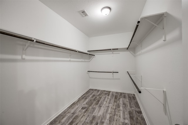 spacious closet featuring hardwood / wood-style flooring