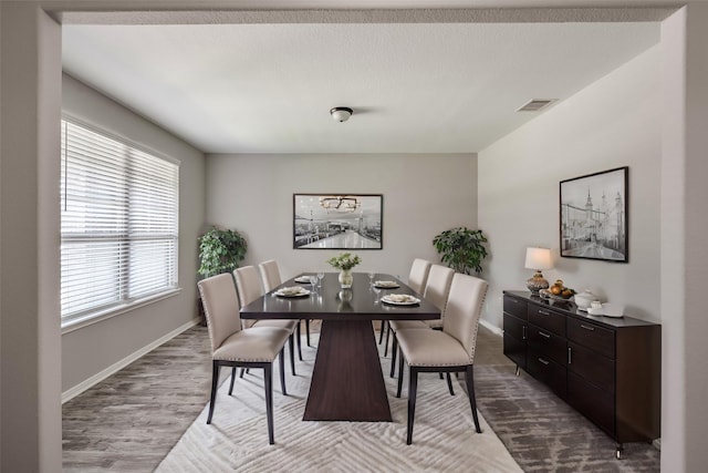 dining area featuring light wood-type flooring