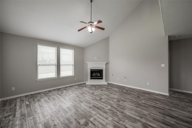 unfurnished living room featuring dark hardwood / wood-style floors, high vaulted ceiling, and ceiling fan