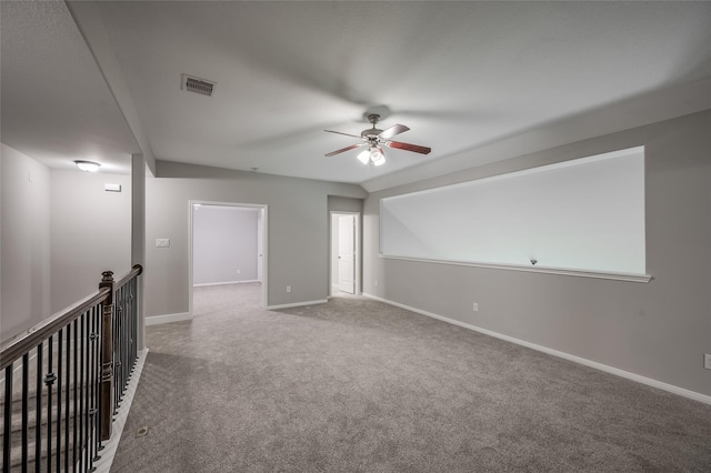 additional living space with ceiling fan and carpet floors