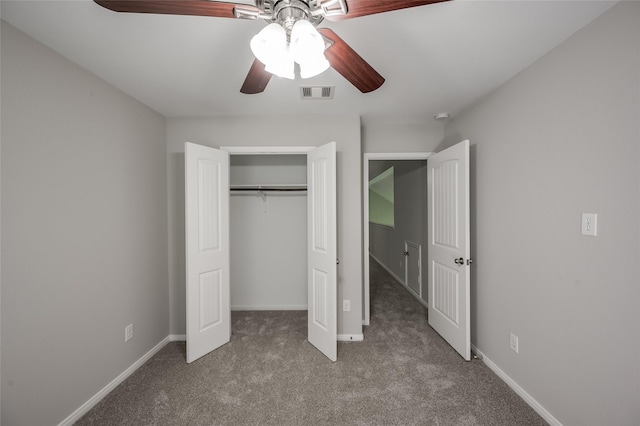 unfurnished bedroom with carpet, ceiling fan, and a closet