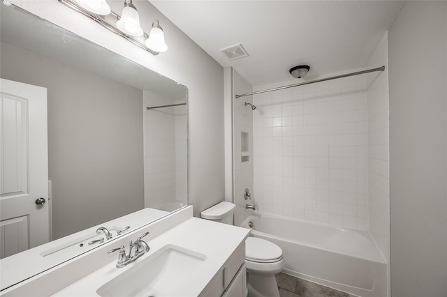 full bathroom with tile patterned floors, vanity, shower / bathtub combination, and toilet