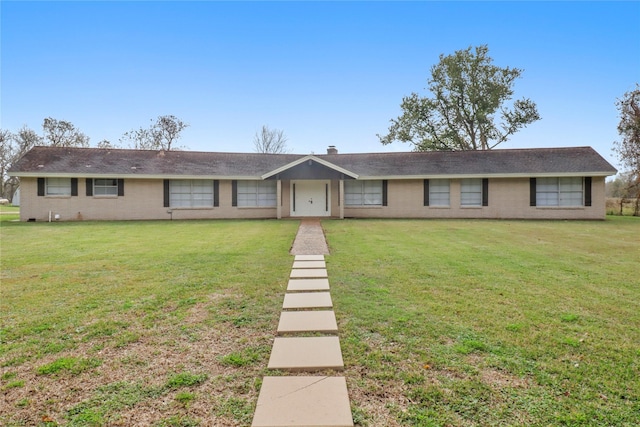 ranch-style home with a front yard