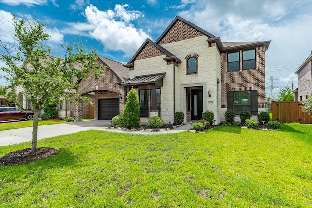 view of front of home with a garage and a front yard