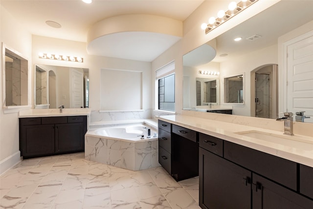 bathroom with vanity and plus walk in shower