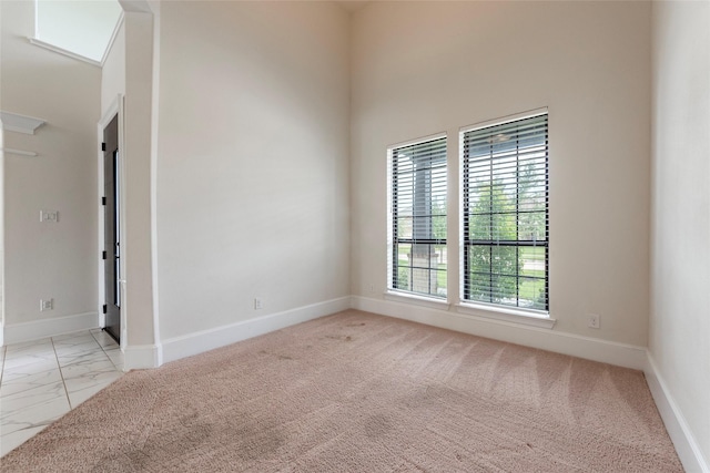 empty room featuring light colored carpet