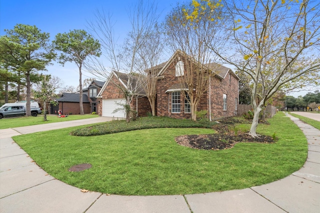 view of front of house featuring a garage and a front lawn