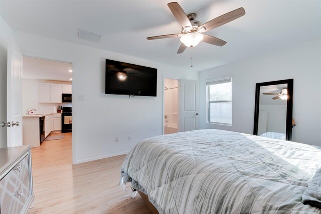 bedroom featuring connected bathroom, ceiling fan, and light hardwood / wood-style floors