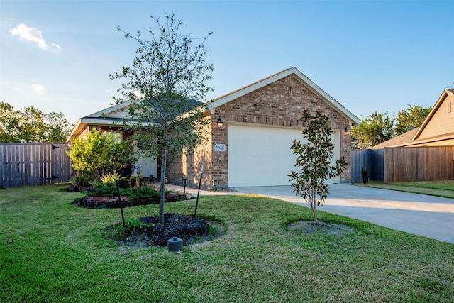 view of front of property featuring a garage and a front lawn