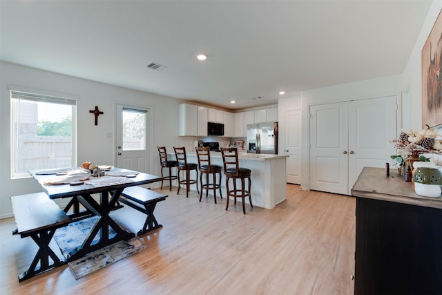 dining space featuring light hardwood / wood-style floors