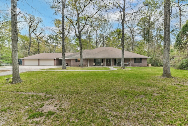 single story home with a front lawn and a garage