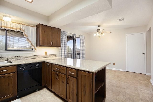 kitchen featuring kitchen peninsula, dishwasher, and plenty of natural light