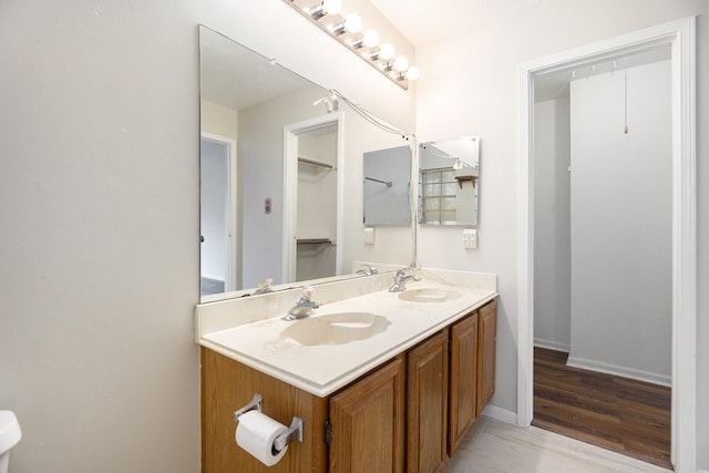 bathroom with hardwood / wood-style floors and vanity