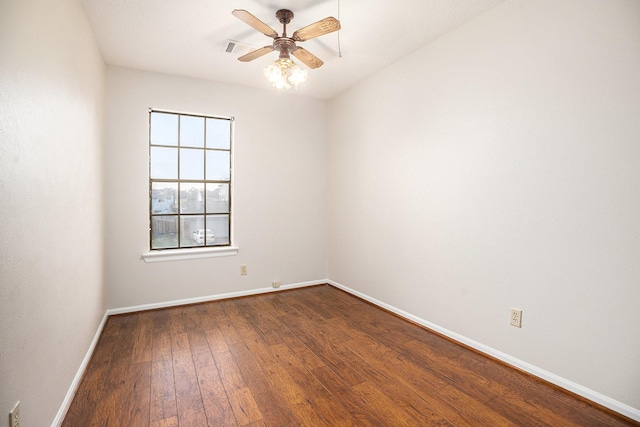 spare room featuring wood-type flooring and ceiling fan