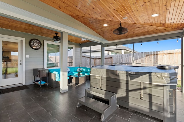 view of patio with outdoor lounge area, a hot tub, and ceiling fan