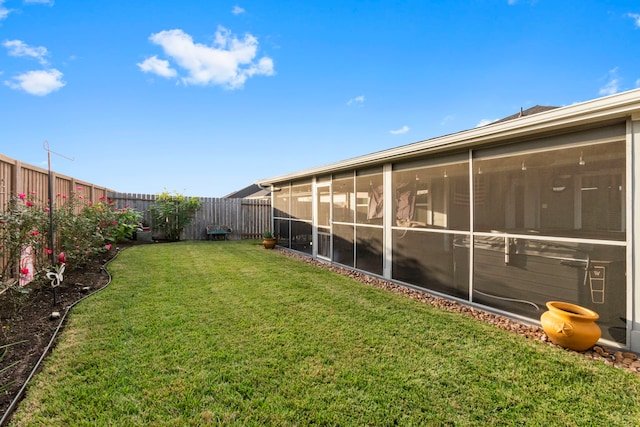 view of yard with a sunroom