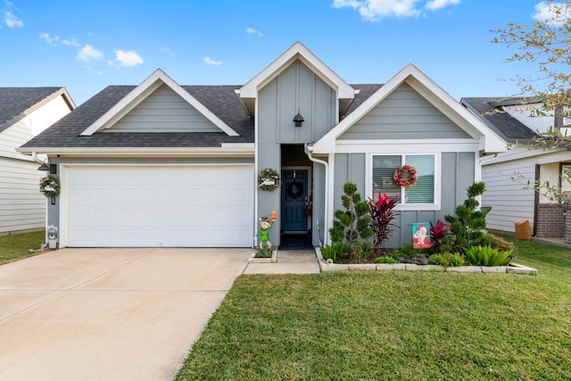 view of front of home with a garage and a front yard