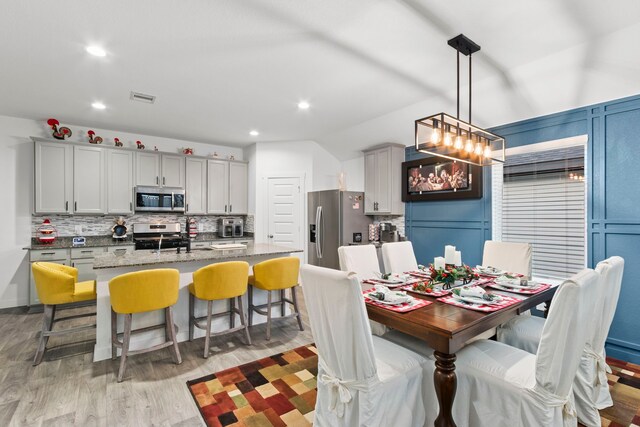 dining room with light hardwood / wood-style floors