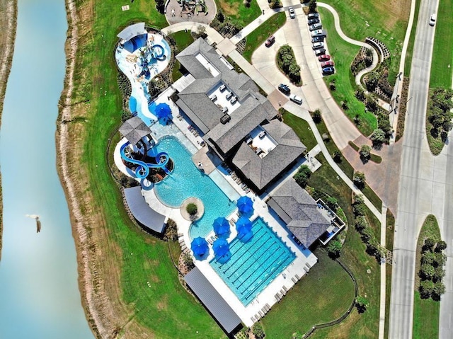 birds eye view of property with a water view