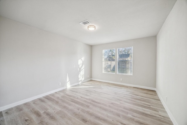 unfurnished room with light hardwood / wood-style flooring